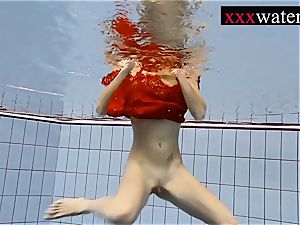fantastic super-hot nymph swimming in the pool