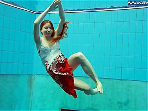 molten polish redhead swimming in the pool